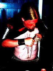 P. (guitars on Watain) cutting off his nipple)